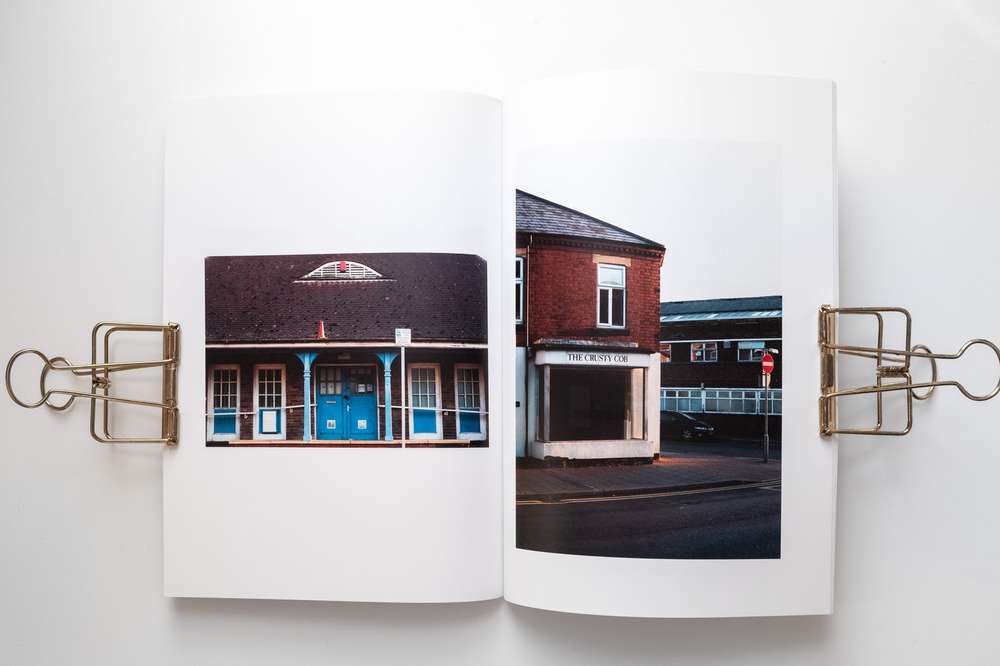 Empty town buildings; a stop sign for the economic decline